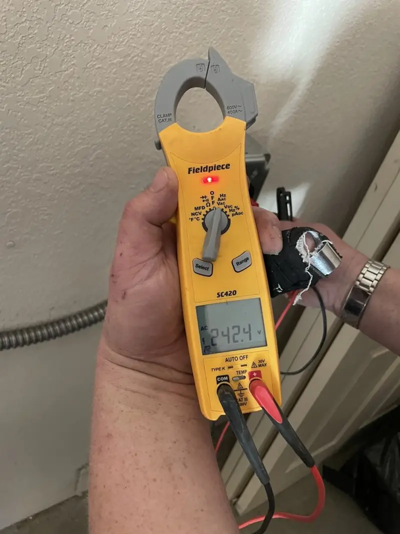 Voltage testing with clamp meter during Generator Installation in Cherry Valley